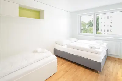 Ein Bett oder Betten in einem Zimmer der Unterkunft myNext - Hotel Leo