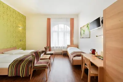 Ein Bett oder Betten in einem Zimmer der Unterkunft Hotel Mocca