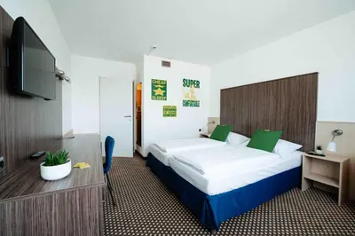 Ein Bett oder Betten in einem Zimmer der Unterkunft SLEEEP Hotel Vösendorf