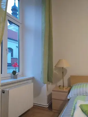 Ein Bett oder Betten in einem Zimmer der Unterkunft Ferienwohnung Schloessel 26/16