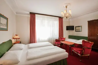 Ein Bett oder Betten in einem Zimmer der Unterkunft Hotel Pension Suzanne