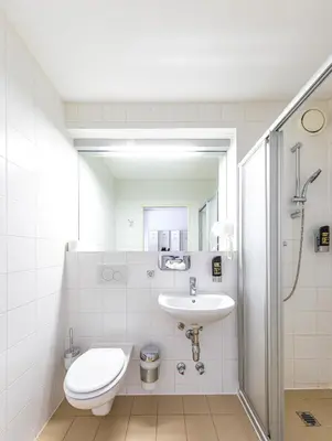 Ein Badezimmer in der Unterkunft A&T Hotel & Hostel