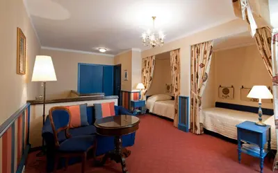 Ein Bett oder Betten in einem Zimmer der Unterkunft Hotel König von Ungarn