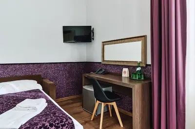 Ein Bett oder Betten in einem Zimmer der Unterkunft Hotel Pension Baron am Schottentor