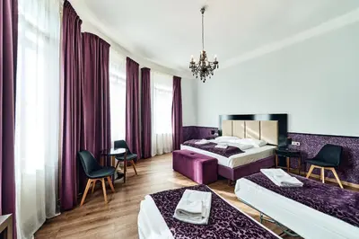 Ein Bett oder Betten in einem Zimmer der Unterkunft Hotel Pension Baron am Schottentor