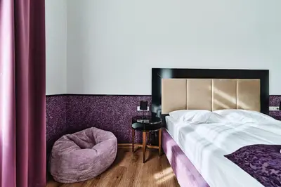 Ein Bett oder Betten in einem Zimmer der Unterkunft Hotel Pension Baron am Schottentor
