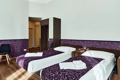 Ein Bett oder Betten in einem Zimmer der Unterkunft Hotel Pension Baron am Schottentor