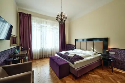 Ein Bett oder Betten in einem Zimmer der Unterkunft Hotel Pension Baron am Schottentor