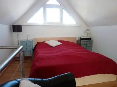 Ein Bett oder Betten in einem Zimmer der Unterkunft Bootshaus am See