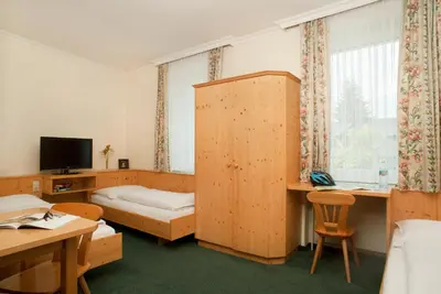 Ein Bett oder Betten in einem Zimmer der Unterkunft Hubertushof Fromwald Hotel und Gasthof