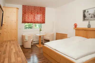 Ein Bett oder Betten in einem Zimmer der Unterkunft Hubertushof Fromwald Hotel und Gasthof