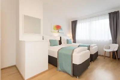 Ein Bett oder Betten in einem Zimmer der Unterkunft Mar Suite Apartments - Center