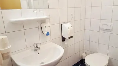 Ein Badezimmer in der Unterkunft G&K Hotel