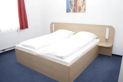 Ein Bett oder Betten in einem Zimmer der Unterkunft G&K Hotel