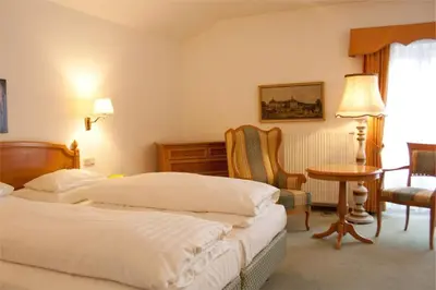Ein Bett oder Betten in einem Zimmer der Unterkunft Hotel Landhaus Fuhrgassl-Huber