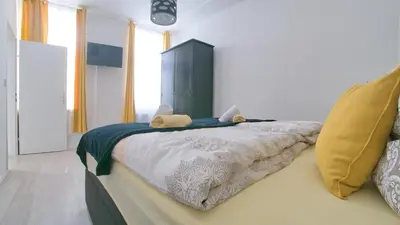 Ein Bett oder Betten in einem Zimmer der Unterkunft Niko Apartment Vienna