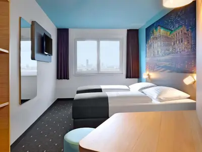 Ein Bett oder Betten in einem Zimmer der Unterkunft B&B Hotel Wien-Hbf