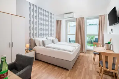 Ein Bett oder Betten in einem Zimmer der Unterkunft Best Western Plus Celebrity Suites