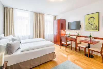 Ein Bett oder Betten in einem Zimmer der Unterkunft Best Western Plus Celebrity Suites