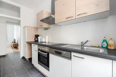 Küche/Küchenzeile in der Unterkunft UNIVERSUM APARTMENT
