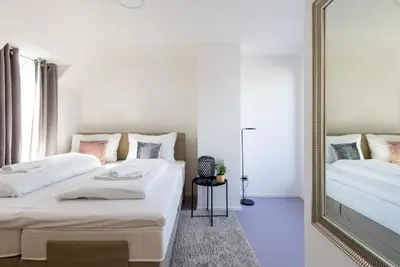 Ein Bett oder Betten in einem Zimmer der Unterkunft Julius 28 - Perfect Stay at Vienna's Central Charm