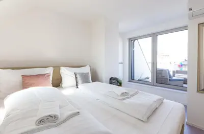 Ein Bett oder Betten in einem Zimmer der Unterkunft Julius 28 - Perfect Stay at Vienna's Central Charm