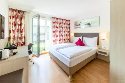 Ein Bett oder Betten in einem Zimmer der Unterkunft Hotel Zeitgeist Vienna Hauptbahnhof