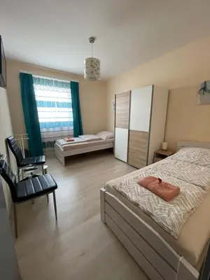 Ein Bett oder Betten in einem Zimmer der Unterkunft Privatzimmer Hammrich