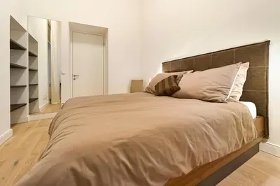 Ein Bett oder Betten in einem Zimmer der Unterkunft Central Luxury Apartment