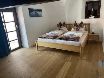 Ein Bett oder Betten in einem Zimmer der Unterkunft Ferienhaus beim Turm