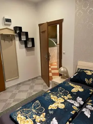 Ein Bett oder Betten in einem Zimmer der Unterkunft Viktoria ARTUR