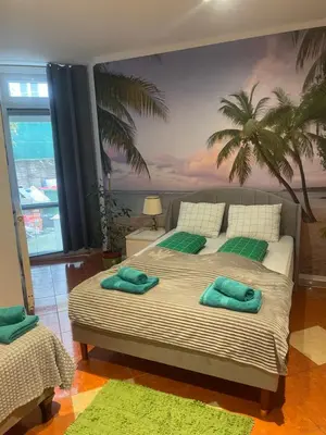 Ein Bett oder Betten in einem Zimmer der Unterkunft Viktoria ARTUR