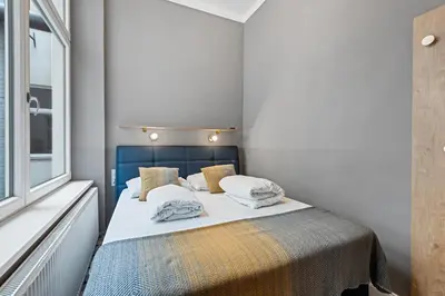 Ein Bett oder Betten in einem Zimmer der Unterkunft KH Opera Apartments