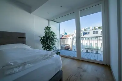 Ein Bett oder Betten in einem Zimmer der Unterkunft Moderne trifft Tradition im Herzen Wiens