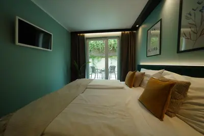 Ein Bett oder Betten in einem Zimmer der Unterkunft Hotel BEE GREEN Schönbrunn