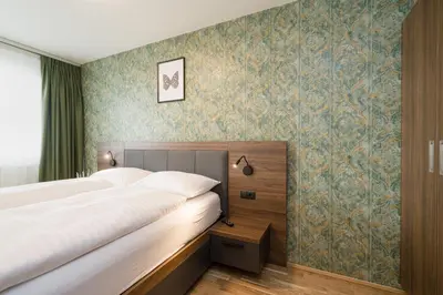 Ein Bett oder Betten in einem Zimmer der Unterkunft MyApartments Vienna