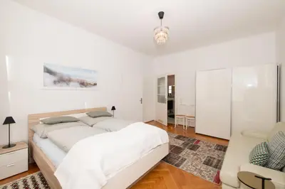 Ein Bett oder Betten in einem Zimmer der Unterkunft Apartment Villa Penzing
