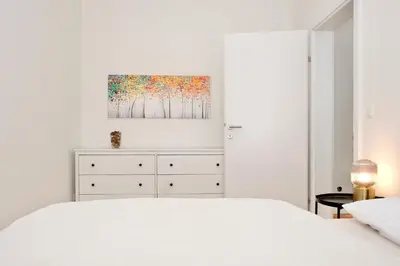 Ein Bett oder Betten in einem Zimmer der Unterkunft Triple A Apartments