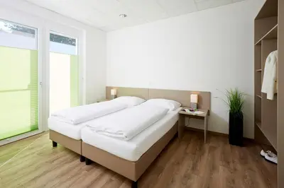 Ein Bett oder Betten in einem Zimmer der Unterkunft Good Rooms GmbH Guntramsdorf