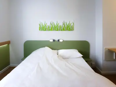 Ein Bett oder Betten in einem Zimmer der Unterkunft Ibis budget Wien Messe