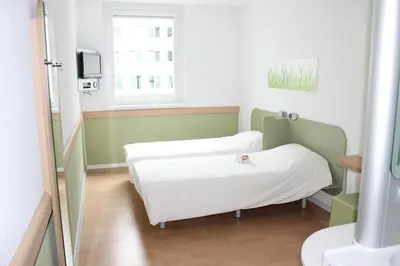 Ein Bett oder Betten in einem Zimmer der Unterkunft Ibis budget Wien Messe