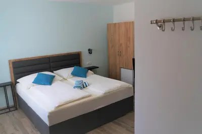 Ein Bett oder Betten in einem Zimmer der Unterkunft Gästehaus Gisch Sandra