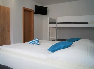 Ein Bett oder Betten in einem Zimmer der Unterkunft Gästehaus Gisch Sandra