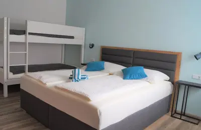 Ein Bett oder Betten in einem Zimmer der Unterkunft Gästehaus Gisch Sandra