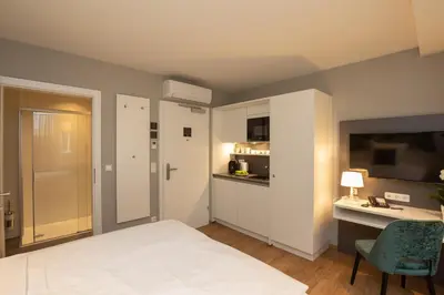 Ein Bett oder Betten in einem Zimmer der Unterkunft Wilmas Apartments by Arbio
