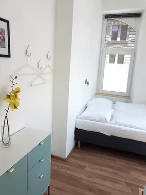 Ein Bett oder Betten in einem Zimmer der Unterkunft Sobieski Town Apartments
