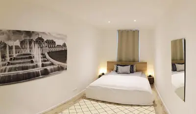 Ein Bett oder Betten in einem Zimmer der Unterkunft Yeshello Belvedere Apartment