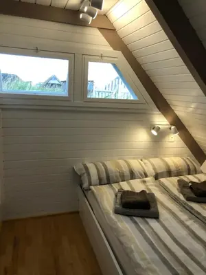 Ein Bett oder Betten in einem Zimmer der Unterkunft Seehütte Neusiedlersee - Pfahlbau Waterfront 1