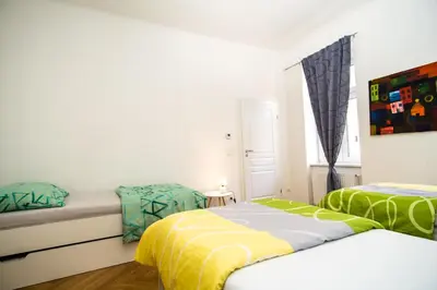 Ein Bett oder Betten in einem Zimmer der Unterkunft Raimond Apartment Ottakring Top 22