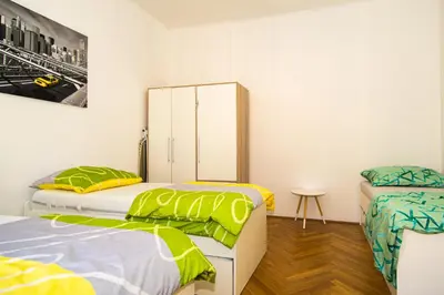 Ein Bett oder Betten in einem Zimmer der Unterkunft Raimond Apartment Ottakring Top 22